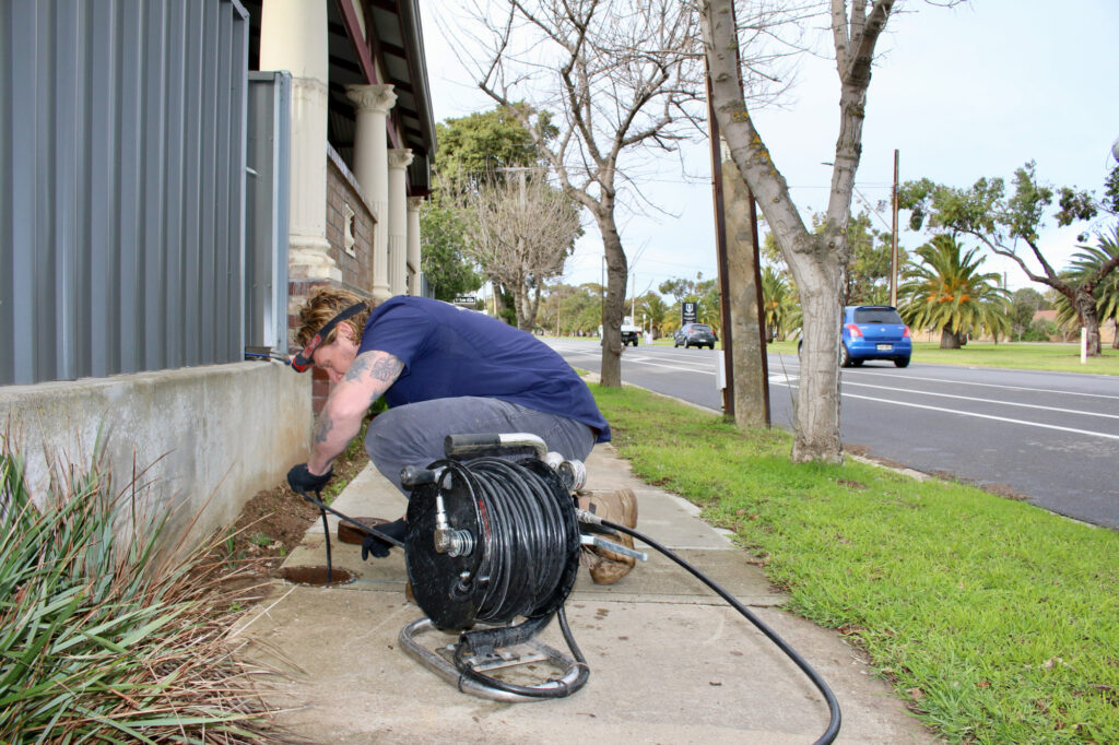 koala plumbing plumber unblocking a drain
